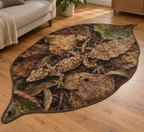 Camouflaged leaf-tailed gecko over layered brown leaf litter printed inside a continuous leaf-shaped bound rug contour