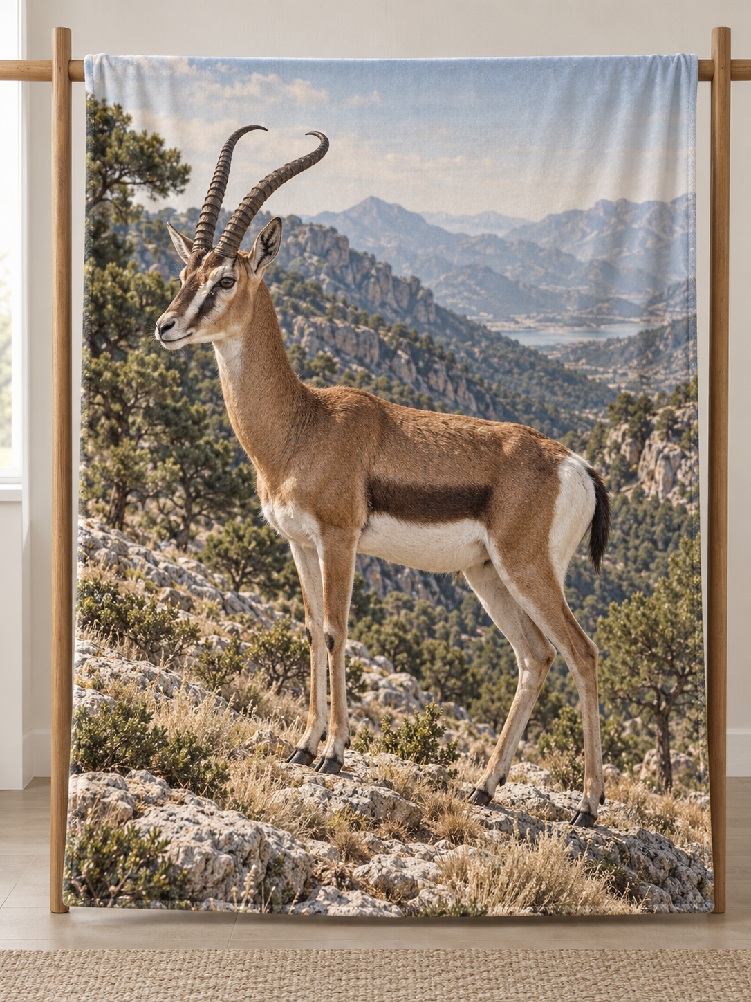 Cuviers gazelle among crisp rocks before a deep mountain woodland valley printed on a complete fleece blanket