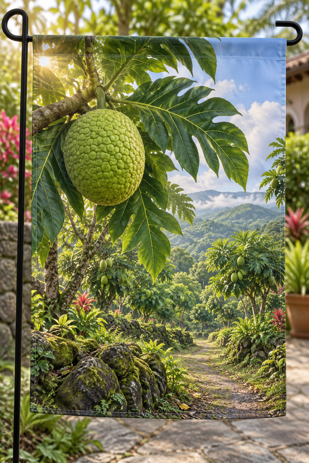 Green breadfruit and lobed leaves before a deep orchard path printed on a complete hemmed flag