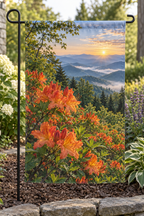 Orange flame azalea flowers and green leaves before misty mountains at sunrise printed on a complete rectangular garden flag with top sleeve