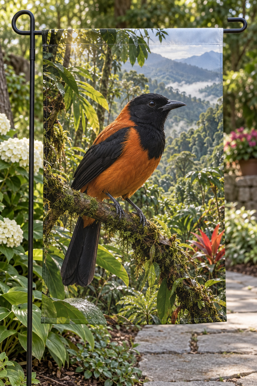 Tawny hooded pitohui with black head wings and tail perched before rainforest printed on a complete garden flag
