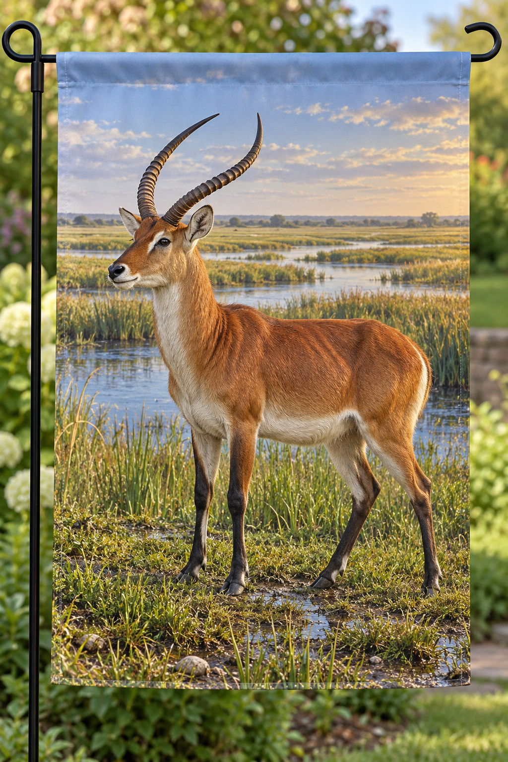 Chestnut lechwe beside deep wetland channels printed on a complete hemmed garden flag