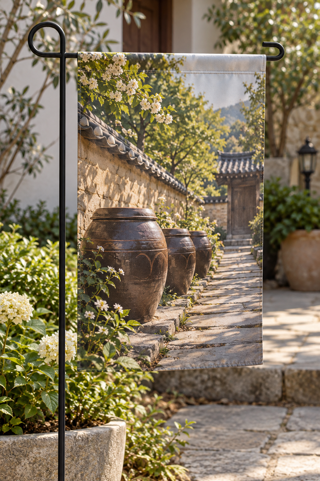 Onggi-inspired earthenware jars along a sunlit Korean stone courtyard printed on a garden flag