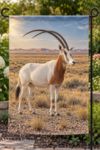 Scimitar-horned oryx among gravel and grasses before deep arid steppe printed on a complete hemmed flag