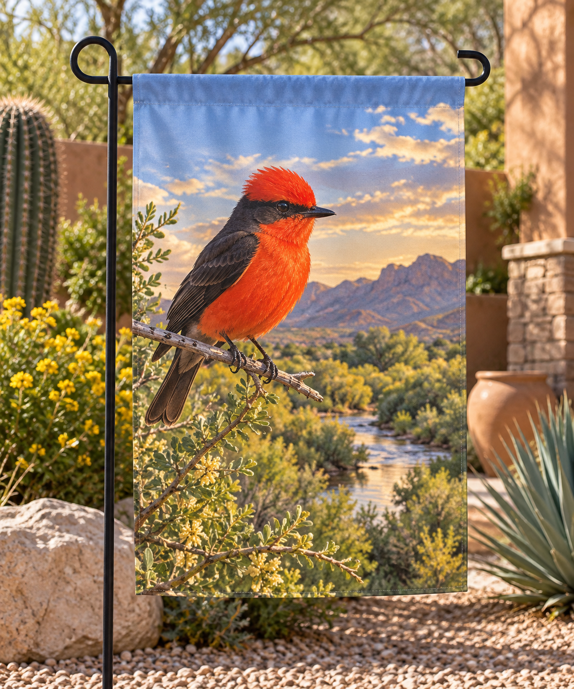 Scarlet vermilion flycatcher with dark eye mask and wings above a stream landscape printed on a complete garden flag