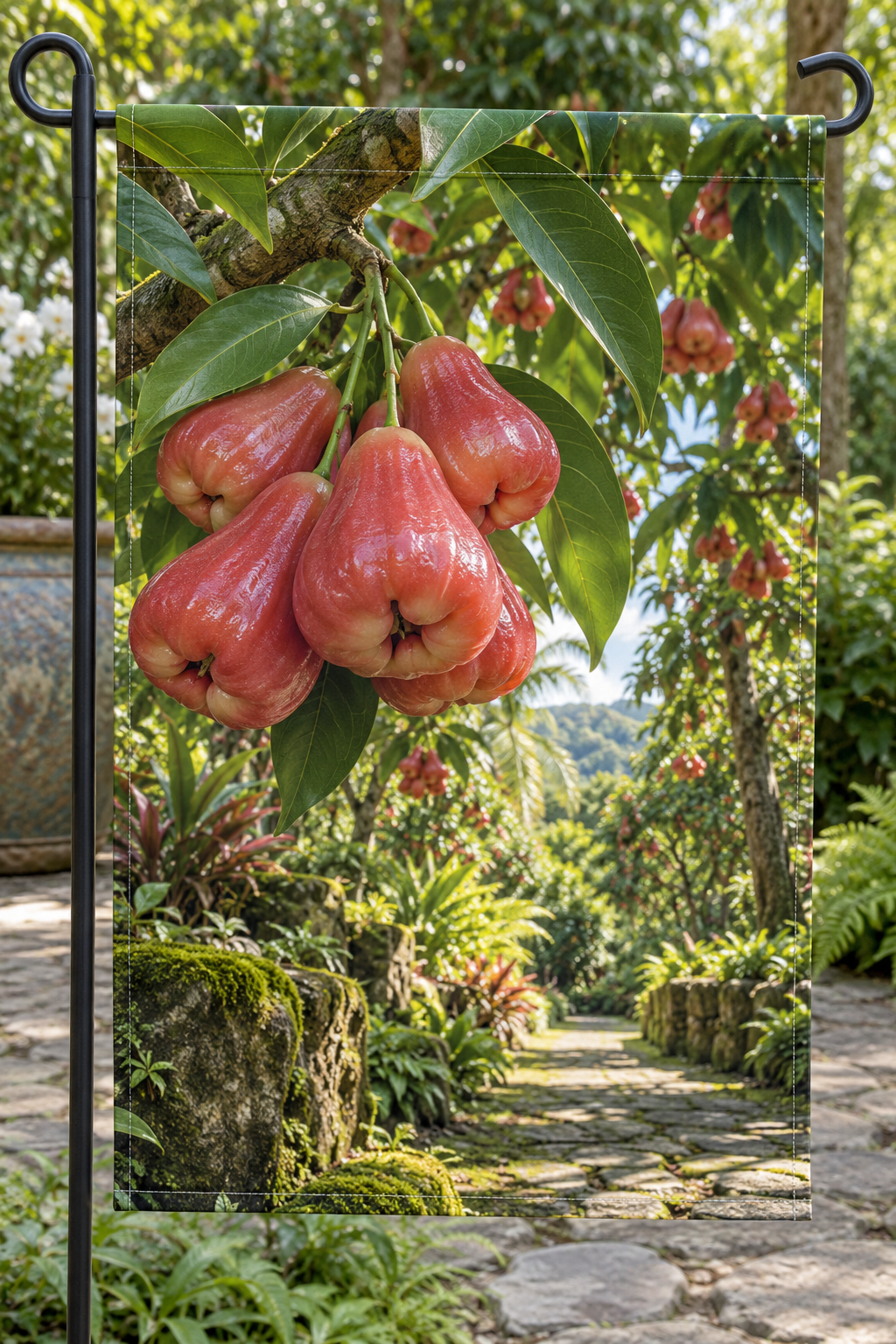 Rosy-red bell-shaped wax apples and oval leaves before a deep orchard path printed on a complete hemmed flag