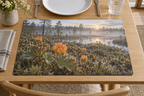 Amber cloudberries and lobed leaves above moss before a receding boreal bog printed on a complete rectangular linen-textured placemat