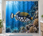 Black clown triggerfish with white spots yellow lips and patterned back before blue coral reef printed on a complete shower curtain
