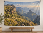 Layered highland escarpments and deep valleys printed on a complete landscape wall tapestry held by external clips