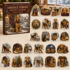Airedale Terrier advent calendar box and 24 illustrated acrylic charms displayed on an ivory tabletop in a winter setting