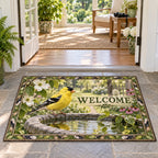 Complete doormat with correct WELCOME, goldfinch on birdbath and a green leaf-and-feather border.