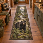 Complete runner with fern-and-root border; black bear before a winding stream and distant mountain forest.
