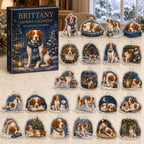 Brittany advent calendar box and 24 illustrated acrylic charms displayed on an ivory tabletop in a winter setting