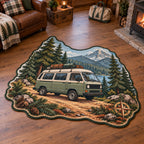 Sage camper van custom shape area rug with pine forest, mountain lake and trail motifs in a rustic travel-inspired room.