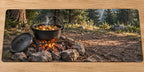 Campfire Cooking Dutch Oven Desk Mat with printed iron pot, embers and woodland depth