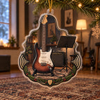 Opaque printed acrylic ornament with a clear rim and supported gold cord; plain headstock after revision, evergreen accents and guitar.