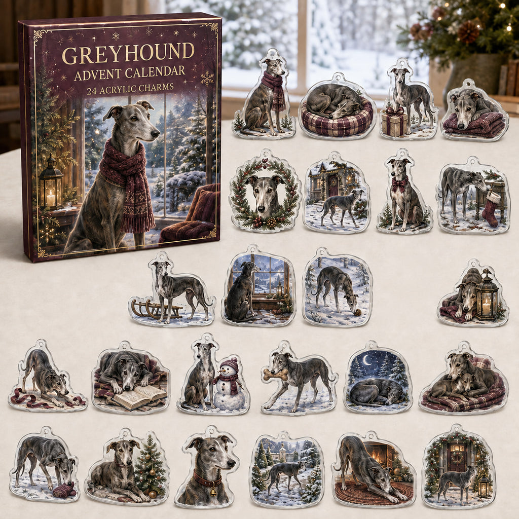 Greyhound advent calendar box and 24 illustrated acrylic charms displayed on an ivory tabletop in a winter setting