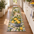 Long runner rug with lemon-filled blue-white bowl, citrus blossom rails and distant courtyard path.
