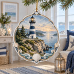 Navy and white lighthouse on a rocky calm harbor printed on a christmas ornament in a pale coastal room.