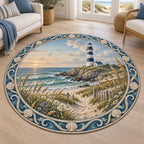 Round rug with striped lighthouse, dune path, wildflowers and shell-and-wave border in a coastal room.
