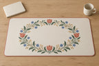 Folk Floral Wedding Wreath Desk Mat with dimensional printed themed artwork; representative AI-generated mockup.