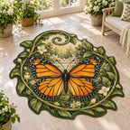Custom Shape Area Rug showing a monarch butterfly with four orange-and-black wings, curling green vines and cream garden details.