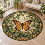 Round Mat Rug showing a monarch butterfly with four orange-and-black wings, curling green vines and cream garden details.