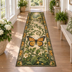 Runner Rug showing a monarch butterfly with four orange-and-black wings, curling green vines and cream garden details.