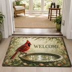 Northern cardinal perched at a stone birdbath with matching botanical border on doormat