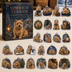 Norwich Terrier advent calendar box and 24 illustrated acrylic charms displayed on an ivory tabletop in a winter setting