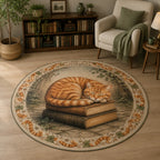 Orange tabby resting on antique books with ivy and coordinated feline border on round mat rug