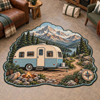 Cream-and-blue retro camper beneath mountain ridges printed on a custom shape area rug in an outdoor-themed indoor room.