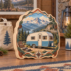 Three-layer wooden block with a cream-and-blue camper, mountain scenery and printed pine and compass frame.