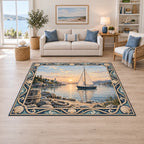 Sailboat harbor area rug with cream sails, sunrise reflections, shoreline rocks, rope and blue cream nautical border.