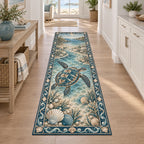 Runner Rug featuring a sea turtle with four flippers, scallop shells, pearl illustrations and teal waves.