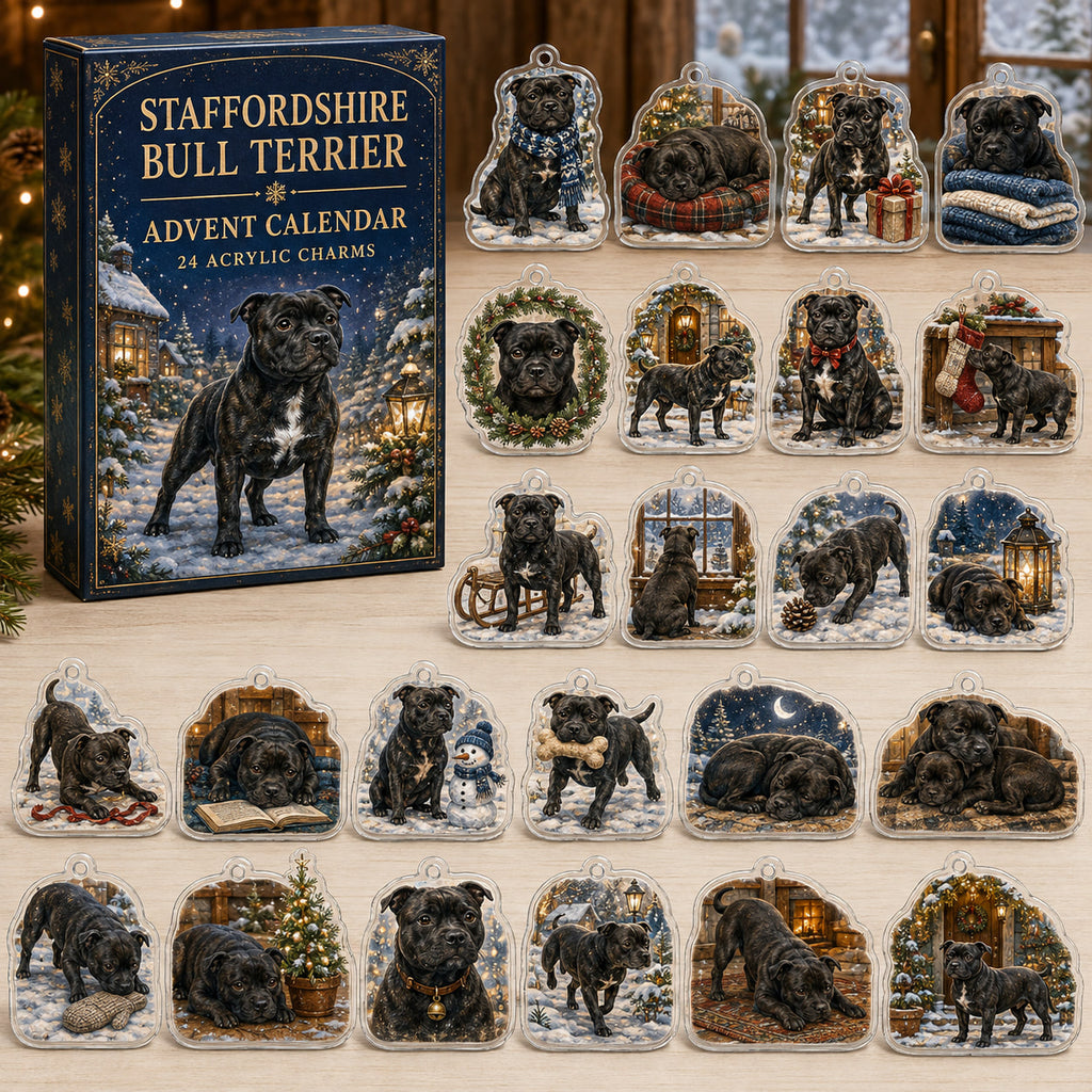 Staffordshire Bull Terrier advent calendar box and 24 illustrated acrylic charms displayed on an ivory tabletop in a winter setting