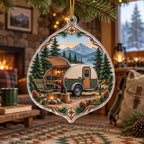 Supported gold cord and thin rim; opaque teardrop trailer campsite with mountain backdrop.