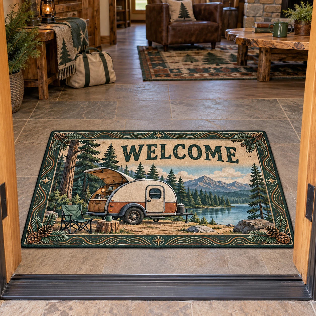 Correct WELCOME and full rectangular outline; trailer, chair and lake framed by pinecones.