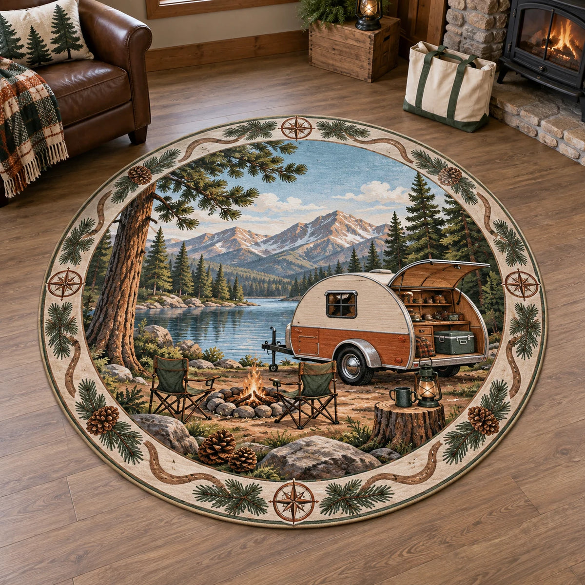 Full circular outline; rounded trailer with wheel and hitch, open rear galley, chairs and lakeside campsite.