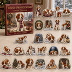 Welsh Springer Spaniel advent calendar box and 24 illustrated acrylic charms displayed on an ivory tabletop in a winter setting